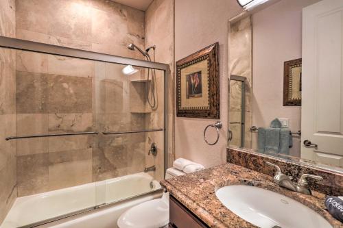 a bathroom with a tub and a sink and a shower at Riverfront Titusville Resort Home with Infinity Pool in Titusville