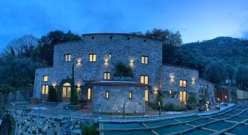 a large stone building with lights on it at Holidays Homes The dream in Sant'Agnello
