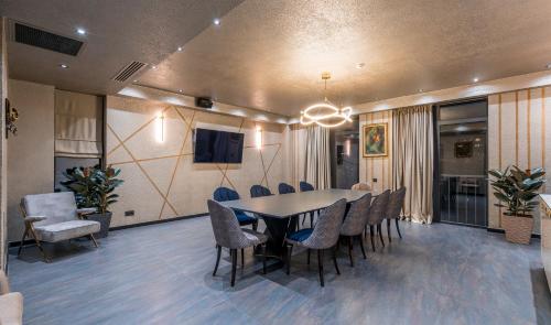 a dining room with a table and chairs at Onyx City Center in Tbilisi City