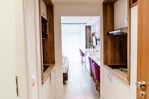 a hallway leading to a kitchen and a dining room at Appartements Am Kranichsee in Hahnenklee-Bockswiese