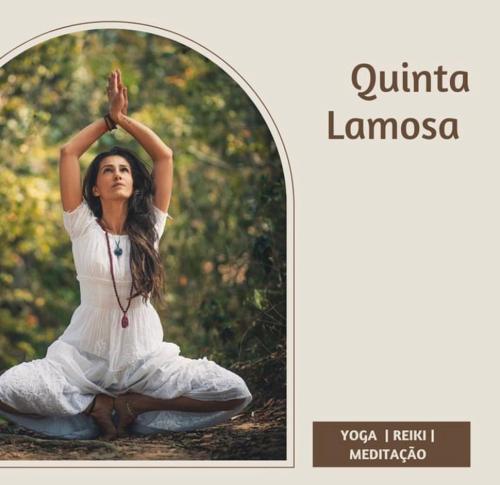 a woman is sitting in a yoga pose at Quinta Lamosa Agroturismo in Arcos de Valdevez