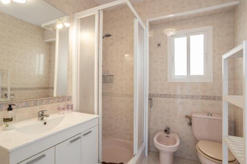 a bathroom with a sink and a toilet and a shower at Sirena in Nerja