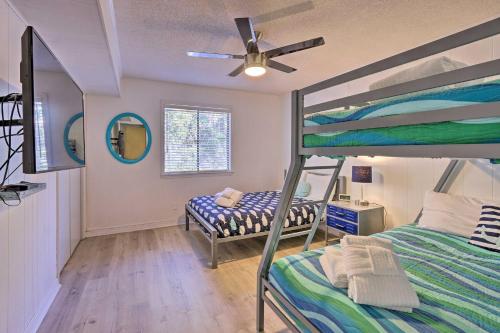 a bedroom with two bunk beds and a ceiling fan at Hilton Head Condo with Shared Pool - Walk to Beach! in Hilton Head Island