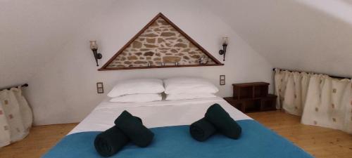 Ένα ή περισσότερα κρεβάτια σε δωμάτιο στο Gîte - Les Pampas - Les Jardins de Kerellec - 20min de la mer - 2/4 personnes – terrasse