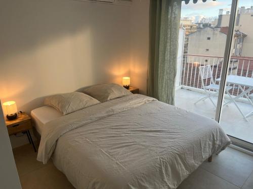 Katil atau katil-katil dalam bilik di PALAIS ROYAL - Appartement tout confort