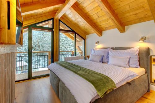 Una cama o camas en una habitación de Rezidence KUPEC