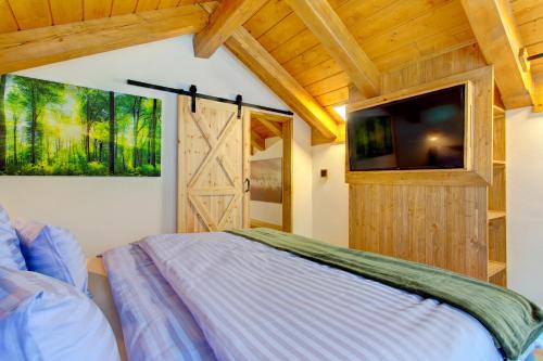 Una cama o camas en una habitación de Rezidence KUPEC