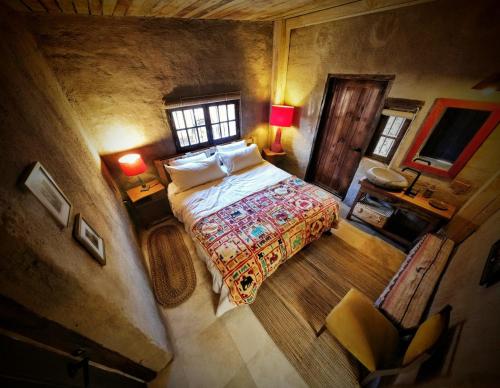 Una cama o camas en una habitación de Espacio Adobe - Hostal Boutique