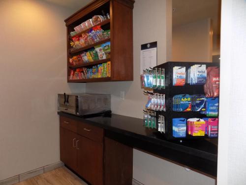 a snack station in a hotel room with snacks at Cobblestone Hotel & Suites - Seward in Seward