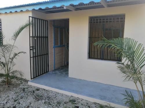 a house with a gate in front of it at El Conde de Villa Rosa in Salado