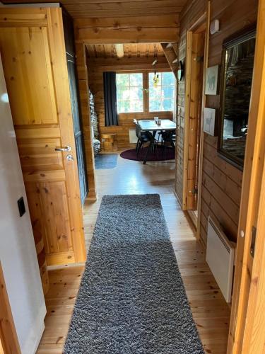 a hallway of a tiny house with a table at Holiday Home Ruka Lammensyli in Ruka