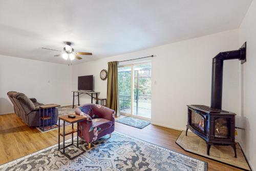 a living room with a wood stove in it at Woodbine Way Retreat in Bellingham