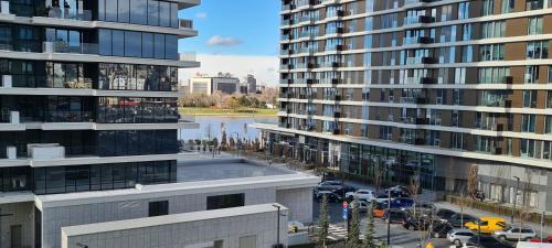 an aerial view of two tall buildings next to a river at Premium Studio Apartment - Belgrade Waterfront in Sajmište