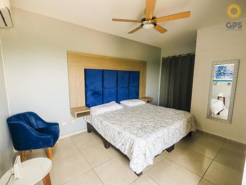 a bedroom with a bed and a ceiling fan at 3010 Habitación en Pacifika, excelente ubicación in Mazatlán