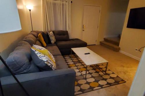 a living room with a couch and a coffee table at Suite 7, Sleep 6, Walk to Attractions in Uptown in Charlotte