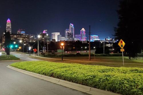 a view of a city skyline at night at Suite 7, Sleep 6, Walk to Attractions in Uptown in Charlotte