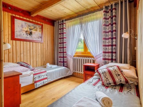 Cama o camas de una habitación en Pokoje Gościnne Anna Wilczek