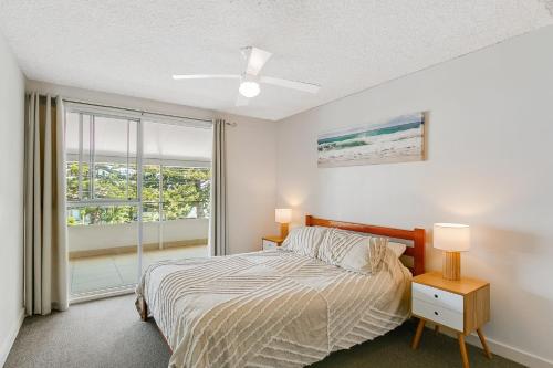 a bedroom with a bed and a window at Tweed Paradise Unit 2 in Coolangatta
