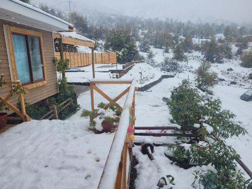 a snow covered porch of a house with snow on the ground at Casa San Francisco in Los Andes