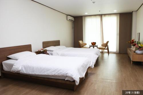 Ένα ή περισσότερα κρεβάτια σε δωμάτιο στο Ilsung Resort Sulak