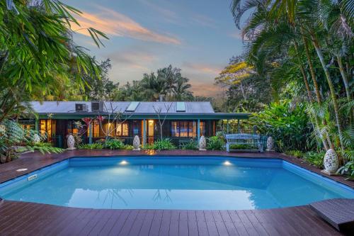 a swimming pool in front of a house at Sanctuary in The Pocket in The Pocket