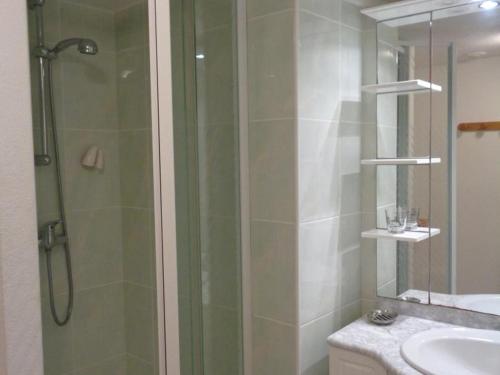 a bathroom with a glass shower and a sink at Gîte Saint-Paul-de-Vézelin, 2 pièces, 3 personnes - FR-1-496-86 in Saint-Paul-de-Vézelin