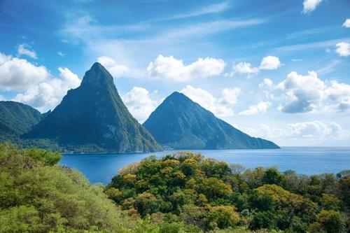 a view of a large body of water with mountains at Paradise Living Apartment in Gros Islet