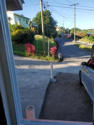 a view of a street from a window at Paradise Living Apartment in Gros Islet