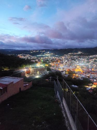 a view of a city at night with lights at La Casa Rosa Guanajuato in Guanajuato