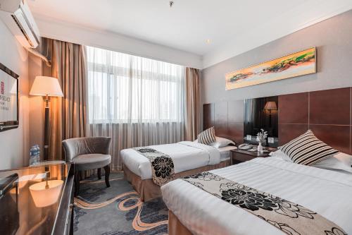 Ένα ή περισσότερα κρεβάτια σε δωμάτιο στο Holiday Inn Express Shanghai Changyang Road by IHG