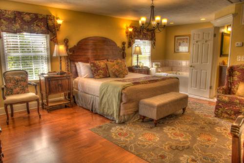 a bedroom with a large bed and a bathroom at Casa De Solana Bed and Breakfast in Saint Augustine