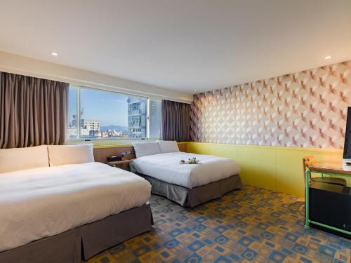 Postel nebo postele na pokoji v ubytování LaVita Hotel