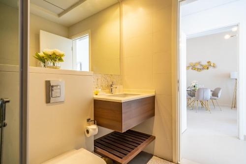 a bathroom with a sink and a toilet at Primestay - Prime Views 1BR Meydan in Dubai