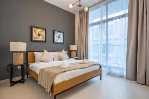 Postel nebo postele na pokoji v ubytování Primestay - 1BR in Prime Views Al Meydan