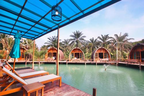 a view of a resort with a swimming pool at Plaiphu Pool Villas in Phangnga