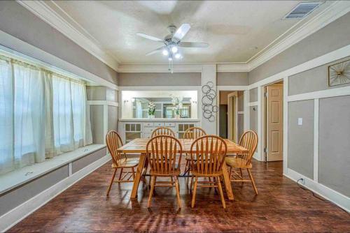 a dining room with a wooden table and chairs at 2 King Beds! Fantastic Stylish Bungalow home! in Fresno