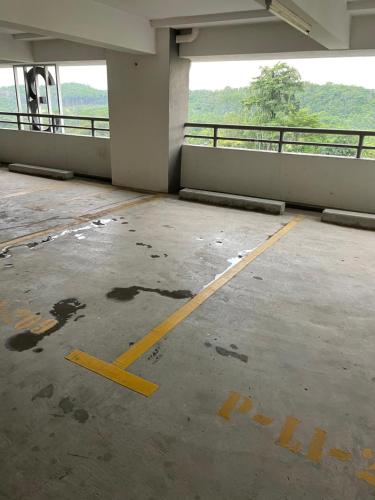 an empty parking lot with a yellow line in a building at AZ Stayz Homestay in Kajang