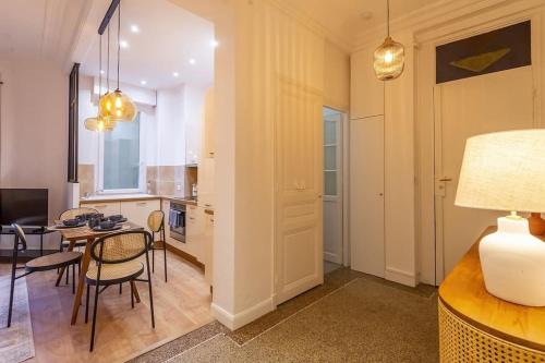 a kitchen and living room with a table and chairs at Superb 2p of standing, all comfort, perfect locati in Nice