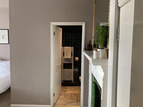 a hallway leading to a room with a bed at 15 Grosvenor in Hastings