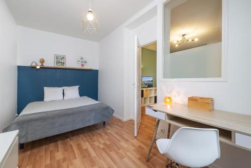 Posteľ alebo postele v izbe v ubytovaní Appart calme avec parking proche place Ney