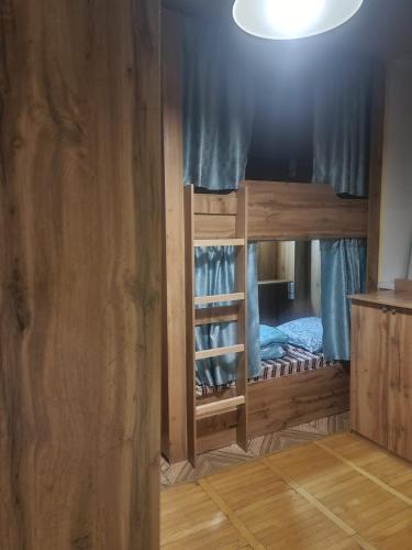 a pair of bunk beds in a room at Golden Square in Almaty