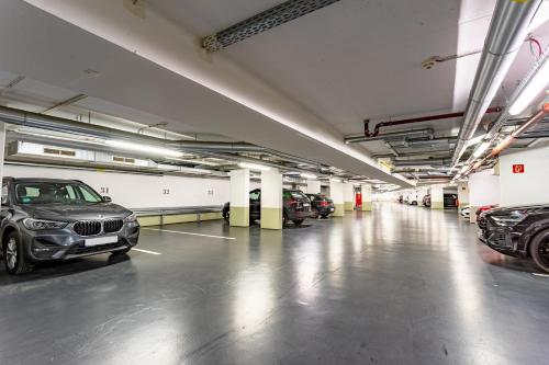 a large parking garage with cars parked in it at Parkhotel Görlitz in Görlitz