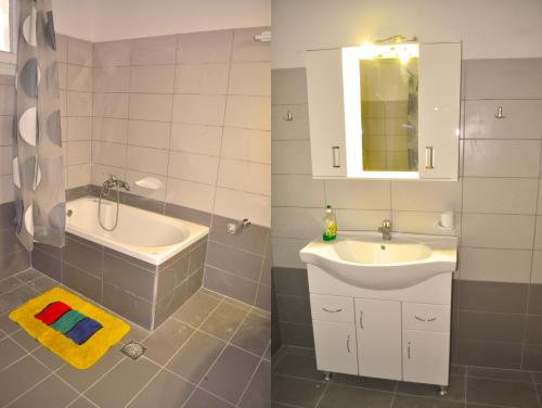 W łazience znajduje się umywalka, lustro, wanna i umywalka. w obiekcie Apartments with swimming pool and panorama sea view - Pelekas Beach w mieście Pelekas