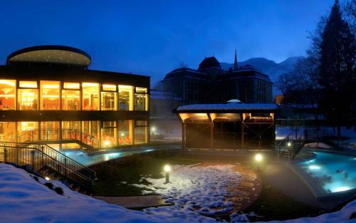 a building in the snow at night at Ferienwohnung Heindl in Bad Ischl