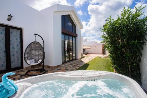 a hot tub in the backyard of a house at Casa Maurizio - Heated Pool, Hot Tub & Hammam in Playa Blanca