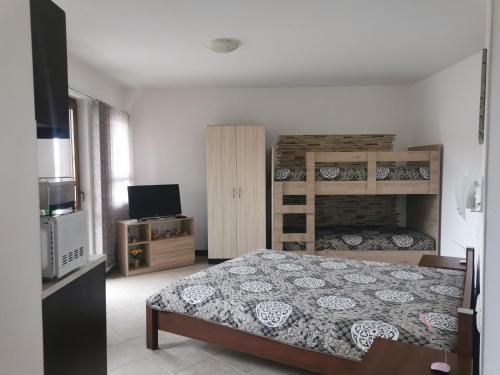 A bed or beds in a room at Pearl Apartments Sozopol