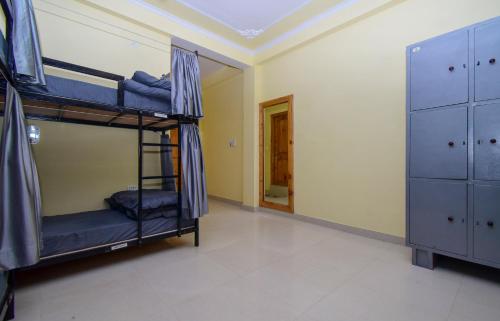 Una cama o camas en una habitación de PerkUp Hostel