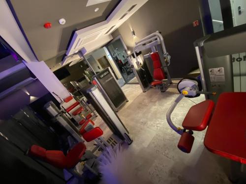 an image of a hospital room with red chairs at Hotel Sanova in Jarosław