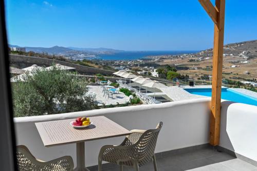 a balcony with a table and chairs and a view at Dolce Vista - Sea View Apartments in Parikia