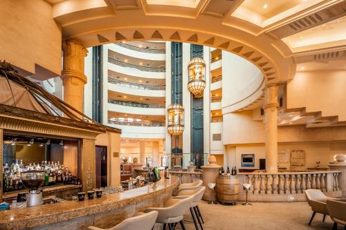 a view of the lobby of a hotel with a bar at Queen of Sheba Eilat in Eilat